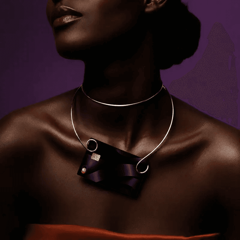 A Bl!nk card worn on a neckpiece as part of an evening look