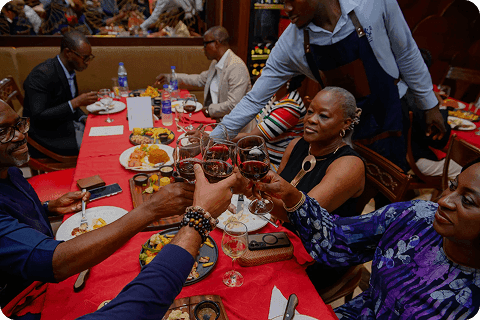 Friends raising a toast around a restaurant table